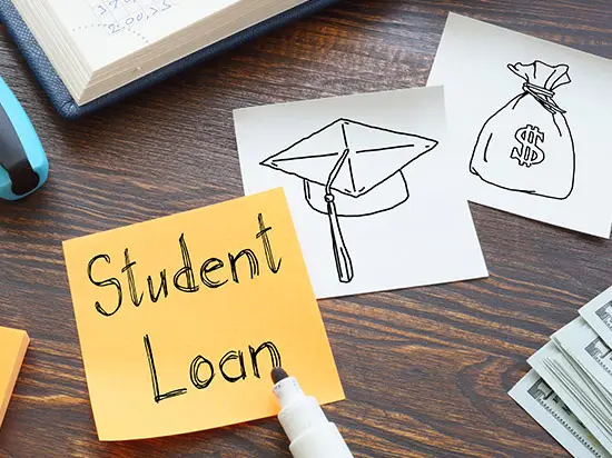 Image of a sticky note with the word student loans written on it