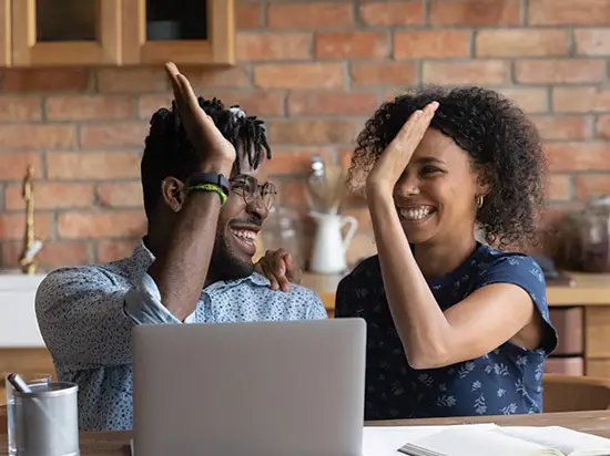 Image of couple high-fiving