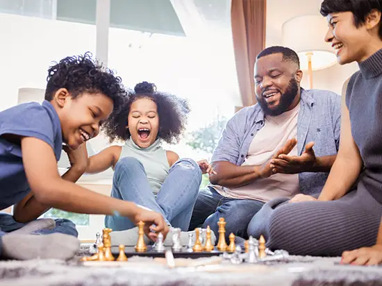 Image of family playing board games