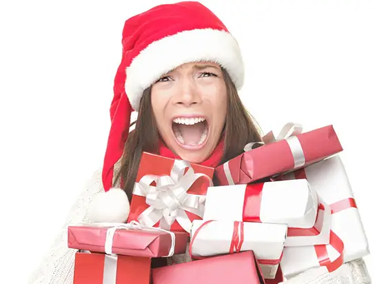 Image of woman holding many presents