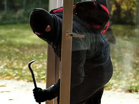 Image of burglar entering home