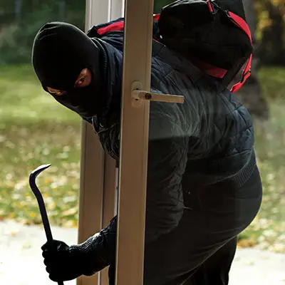 Image of burglar invading house