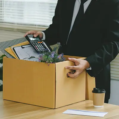 Image of employee packing personal effects