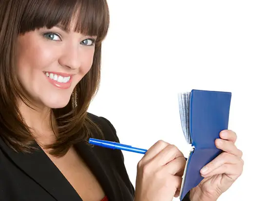 Image of woman writing a check