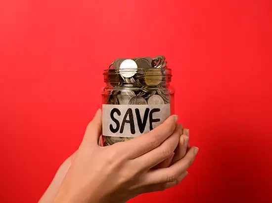Image of jar full of coings labeled SAVE
