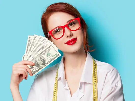Image of woman holding cash