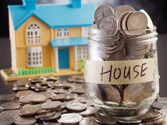 Image of jar of coins labeled HOUSE