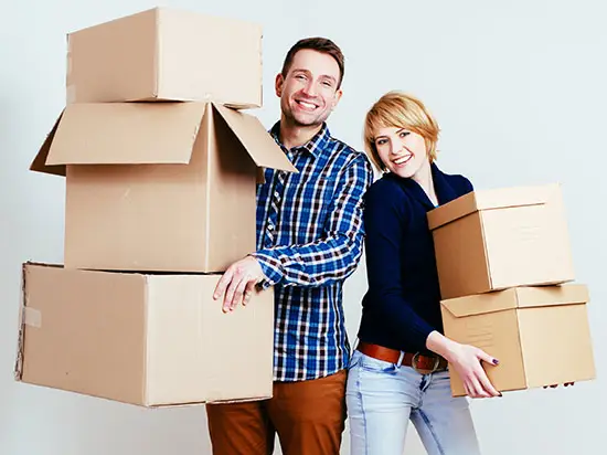 Image of couple with boxes