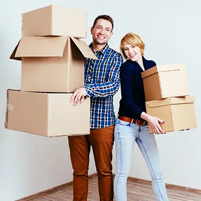 Image of couple holding boxes
