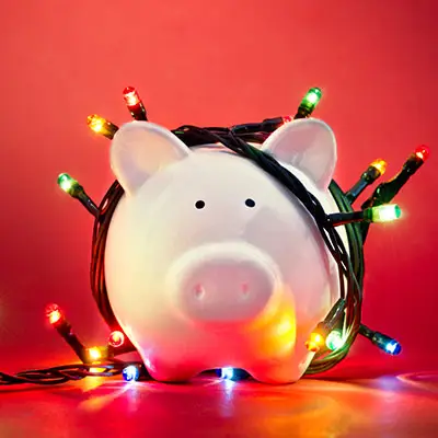 Image of piggy bank with Christmas lights