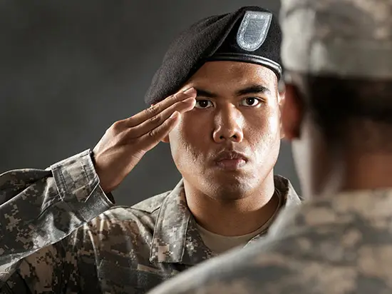 Image of servicemember saluting