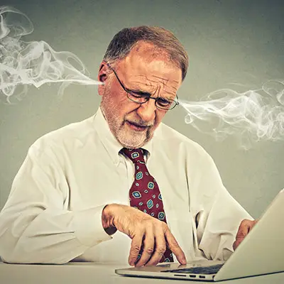 Image of stressed businessman with smoke out of ears