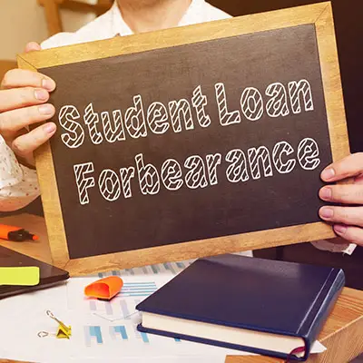 Image of sign stating STUDENT LOAN FOREBEARANCE