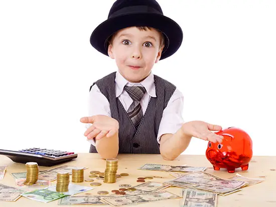Image of boy playing with money