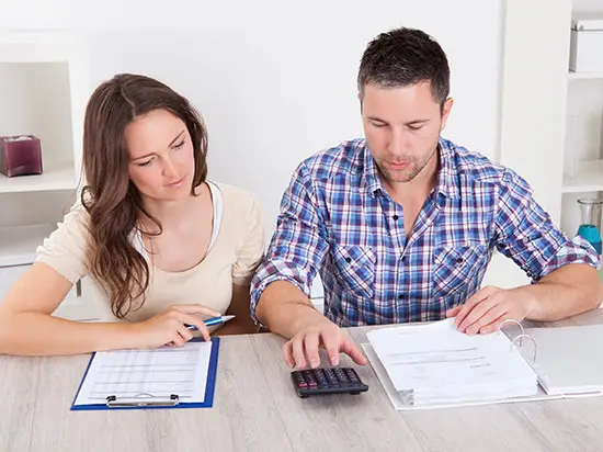 Image of couple reviewing bills