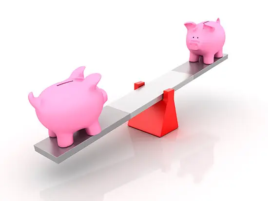 Image of two piggy banks on a teeter-totter