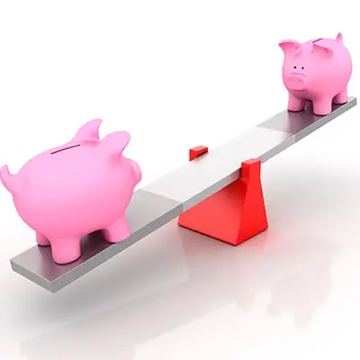 Image of two piggy banks on a teeter totter