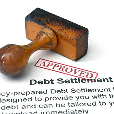Image of debt settlement contract stamped APPROVED