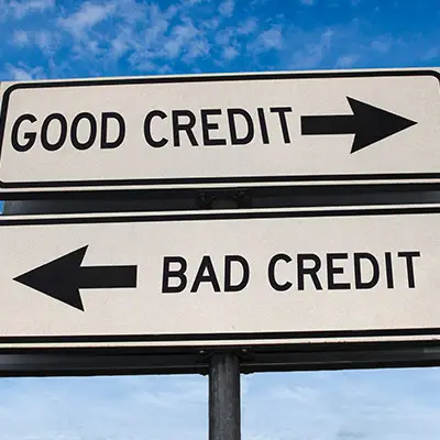 Image of signs reading GOOD CREDIT and BAD CREDIT