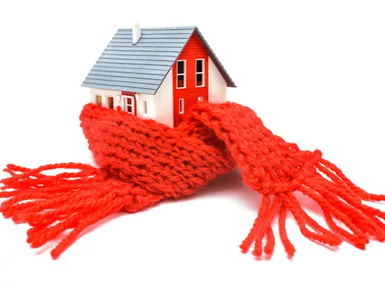 Image of model of a home with a scarf