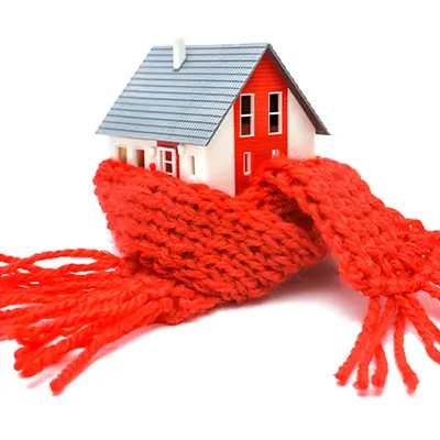 Image of model of a house with a scarf