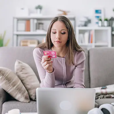 Image of young woman with credit card